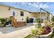 Outdoor patio with lush landscaping, offering a serene space for relaxing and entertaining at 4119 13Th E St, Ellenton, FL 34222