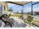 Covered porch with cozy seating, offering a pleasant outdoor living space at 4119 13Th E St, Ellenton, FL 34222