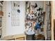 Well-organized storage shed with hanging tools and a shoe organizer, perfect for keeping everything tidy at 4119 13Th E St, Ellenton, FL 34222