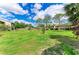 Lush green lawn and trees surrounding the community at 4381 Sandner Dr, Sarasota, FL 34243