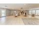 Spacious common area with tables, chairs, bar, and tile flooring, perfect for gatherings at 4381 Sandner Dr, Sarasota, FL 34243