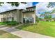 Well-maintained townhome with lush front lawn and garden area at 4381 Sandner Dr, Sarasota, FL 34243