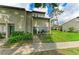 Inviting townhome with vibrant landscaping and well-kept lawn at 4381 Sandner Dr, Sarasota, FL 34243