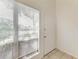 Bright foyer area with a window and neutral tile flooring at 4381 Sandner Dr, Sarasota, FL 34243