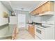 Functional kitchen with white appliances, ample cabinet space, and a bright, airy window at 4381 Sandner Dr, Sarasota, FL 34243