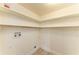 Small laundry room with white walls, tiled floors, and washer hookups at 4381 Sandner Dr, Sarasota, FL 34243