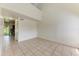 Spacious living room featuring neutral tile flooring and ample natural light at 4381 Sandner Dr, Sarasota, FL 34243