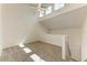 Loft area with a vaulted ceiling, ceiling fan, carpet, and natural light at 4381 Sandner Dr, Sarasota, FL 34243