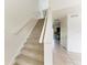 Carpeted staircase and tiled floors connect to the kitchen at 4381 Sandner Dr, Sarasota, FL 34243
