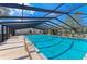 Community pool under a structure with lounge chairs offering a relaxing atmosphere at 4381 Sandner Dr, Sarasota, FL 34243