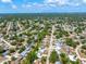 Expansive aerial view showcasing the property nestled among lush greenery in a well-established neighborhood at 4425 Parnell Dr, Sarasota, FL 34232