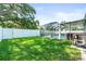 A nicely manicured backyard featuring a screened-in pool and a well-maintained lawn at 4425 Parnell Dr, Sarasota, FL 34232