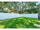 A well maintained backyard enclosed by a white fence, offering privacy and security at 4425 Parnell Dr, Sarasota, FL 34232