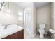 Clean bathroom with a glass door shower, a white toilet, and a white sink at 4425 Parnell Dr, Sarasota, FL 34232