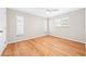 Bright bedroom with laminate floors, a ceiling fan, and multiple windows at 4425 Parnell Dr, Sarasota, FL 34232
