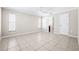 Spacious bedroom with tile flooring, neutral paint, and plenty of natural light from the windows at 4425 Parnell Dr, Sarasota, FL 34232