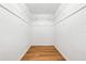 An organized walk-in closet features white walls, baseboards, and wire shelving at 4425 Parnell Dr, Sarasota, FL 34232