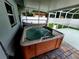 A private hot tub and covered patio offers the perfect space for relaxation at 4425 Parnell Dr, Sarasota, FL 34232