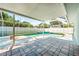 A screened-in pool area provides plenty of space for outdoor lounging and recreation at 4425 Parnell Dr, Sarasota, FL 34232