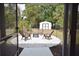 Outdoor fire pit area with chairs and a storage shed, creating a cozy backyard retreat at 4506 20Th W St, Bradenton, FL 34207