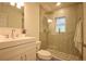 Modern bathroom featuring glass enclosed shower, stylish tile work, and contemporary fixtures and finishes at 4506 20Th W St, Bradenton, FL 34207
