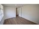 This bedroom has new floors, fresh paint, a large closet, and an open door to another room at 4506 20Th W St, Bradenton, FL 34207