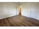 This spacious bedroom features new wood floors, white walls, and a view of the bathroom at 4506 20Th W St, Bradenton, FL 34207