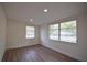 This bright bedroom has new floors, fresh paint, and two windows with window treatments at 4506 20Th W St, Bradenton, FL 34207