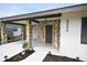 Inviting front entrance with stone details and a well-lit covered porch at 4506 20Th W St, Bradenton, FL 34207