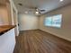 Open living room featuring sleek wood flooring and a ceiling fan at 4506 20Th W St, Bradenton, FL 34207