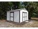 Exterior view of a white storage shed with a gable roof and a double-door entrance at 4506 20Th W St, Bradenton, FL 34207