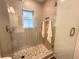 This remodeled bathroom features a tiled shower with a glass enclosure and modern fixtures at 4506 20Th W St, Bradenton, FL 34207