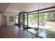 Charming sunroom with wood-look floors, ideal for entertaining or quiet relaxation with views of the backyard at 4506 20Th W St, Bradenton, FL 34207