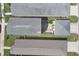 An aerial view showing the rooftops of houses and a back patio at 4811 Woodbrook Dr, Sarasota, FL 34243