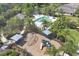Aerial shot of pool and playground in community surrounded by tropical landscaping at 4811 Woodbrook Dr, Sarasota, FL 34243