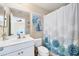 Bathroom with a shower/tub combination and a vanity with a white countertop and ample storage at 4811 Woodbrook Dr, Sarasota, FL 34243