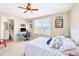Bright bedroom with a bed, desk and en-suite bathroom that receives an abundance of natural light at 4811 Woodbrook Dr, Sarasota, FL 34243