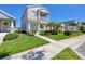 Inviting home with a manicured lawn and charming curb appeal, complemented by lush landscaping along the sidewalk at 4811 Woodbrook Dr, Sarasota, FL 34243