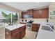 The kitchen features stainless steel appliances, recessed lighting, and an island at 4811 Woodbrook Dr, Sarasota, FL 34243