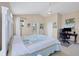 Bright main bedroom with a ceiling fan and a computer desk at 4811 Woodbrook Dr, Sarasota, FL 34243