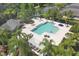Aerial view of community pool with a jacuzzi and covered picnic area at 4811 Woodbrook Dr, Sarasota, FL 34243