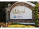 A stone community sign featuring the Woodbrook and Neal Communities names at 4811 Woodbrook Dr, Sarasota, FL 34243