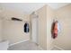Spacious walk-in closet with carpet flooring and installed shelving and hanging rods for storage at 4811 Woodbrook Dr, Sarasota, FL 34243