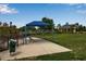 Covered bench with dog park amenities for shade and relaxation at 5036 Brickell Park Cv, Bradenton, FL 34211