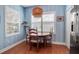 Dining nook showcasing a round table, shuttered windows, and an overhead light fixture at 5036 Brickell Park Cv, Bradenton, FL 34211