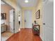 Bright foyer with hardwood floors leading to the living areas, showcasing a welcoming entrance at 5036 Brickell Park Cv, Bradenton, FL 34211
