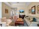 Spacious living room showcases hardwood floors, comfortable seating, and neutral color palette at 5036 Brickell Park Cv, Bradenton, FL 34211