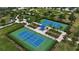 Aerial shot showcasing the tennis courts with shade covers and manicured landscaping at 5036 Brickell Park Cv, Bradenton, FL 34211