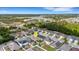 An aerial view captures a peaceful neighborhood close to a lake and community center, featuring a blend of natural and urban elements at 5111 11Th E St, Bradenton, FL 34203