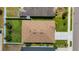 Aerial shot offering a bird's-eye view of the roof and the surrounding well-maintained yard with beautiful landscaping at 5111 11Th E St, Bradenton, FL 34203